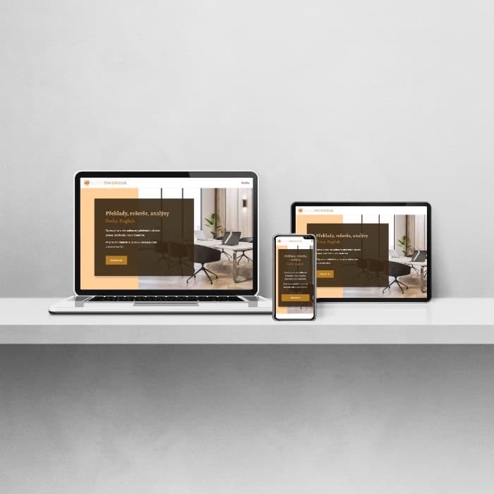 Electronic devices including laptop, tablet, and phone neatly arranged on a table, each showing the homepage of the translator's website.